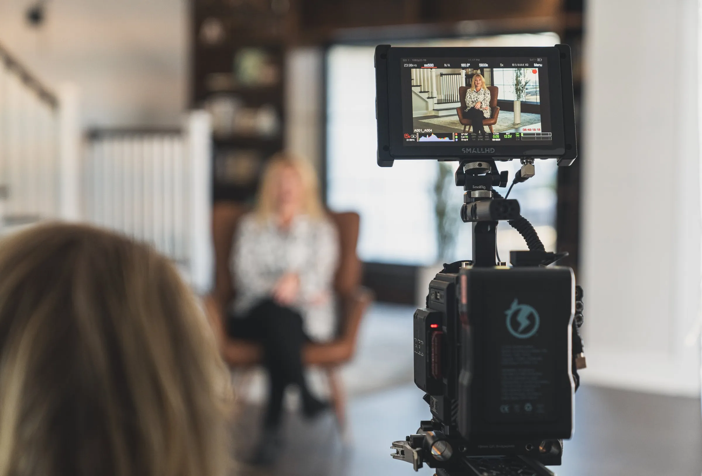 Camera monitor framing an interview subject on set